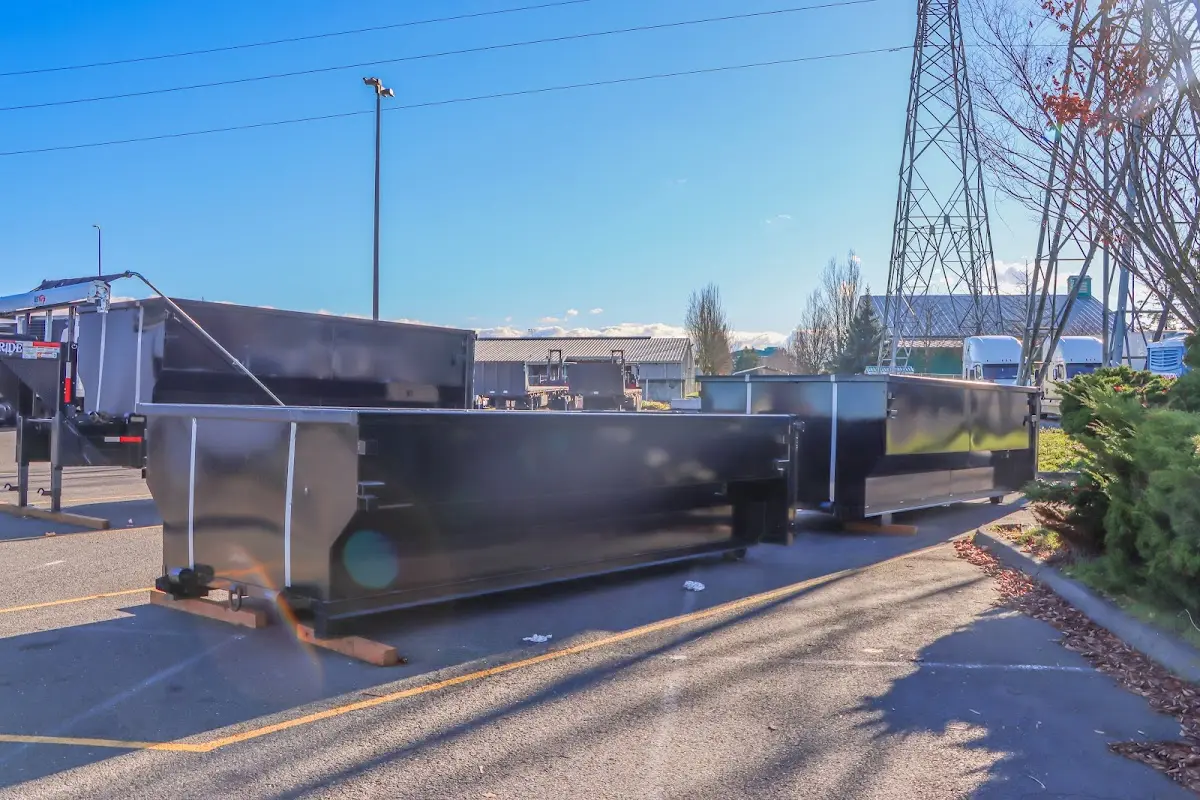 Roll-off dumpster ready for waste disposal at job site for 2 Yard Dumpster Rental in Riga